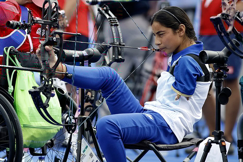 | Photo: AP/Felix Scheyer : Paris Paralympics 2024 Day 1:  Archer Sheetal Devi from India prepares to fire